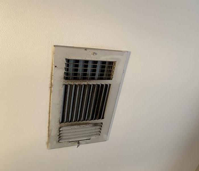 Filthy AC vent that has been collecting dust and needs to be cleaned